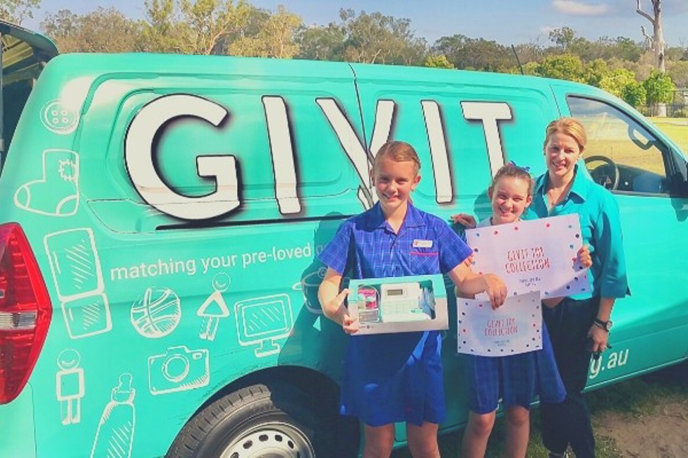GIVIT's QLD Engagement Coordinator with school children next to the GIVIT van donating to the Kids in Care Appeal